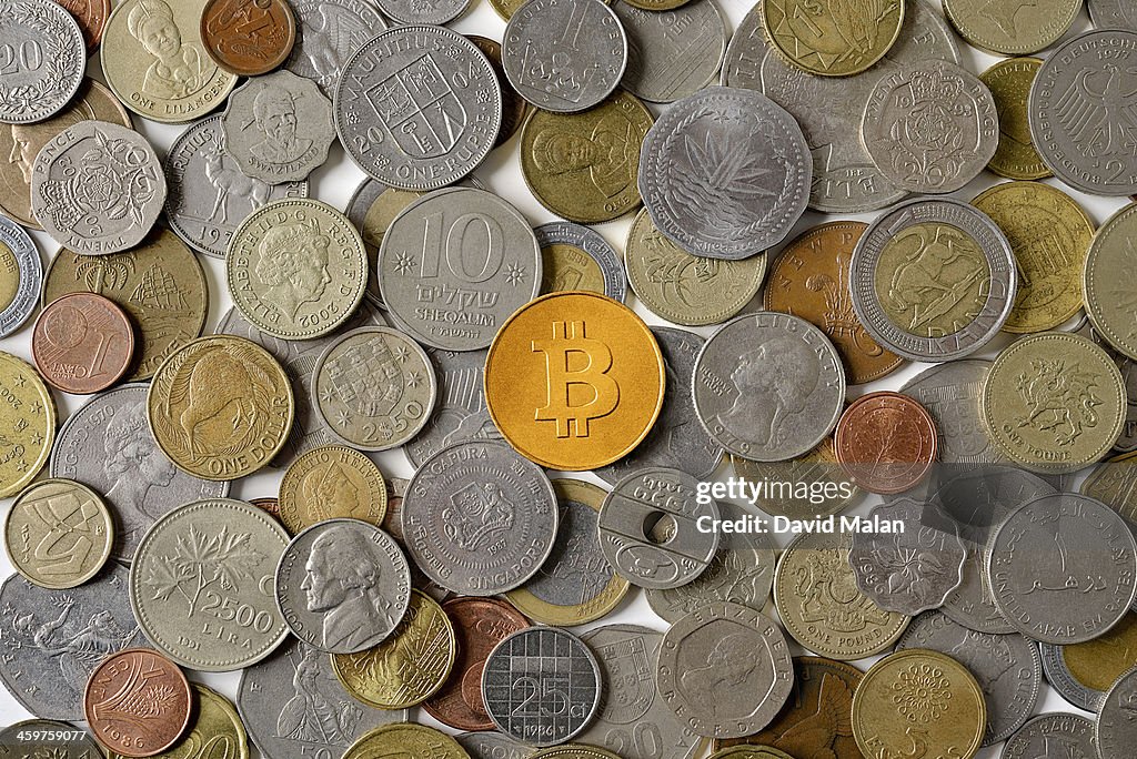 Bitcoin surrounded by various world coins