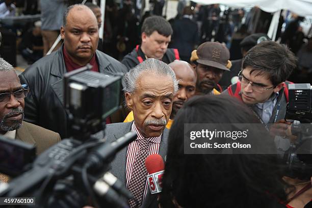 Rev. Al Sharpton speaks with reporters and supporters after addressing services at The Flood Christian Church on November 30, 2014 in Ferguson,...