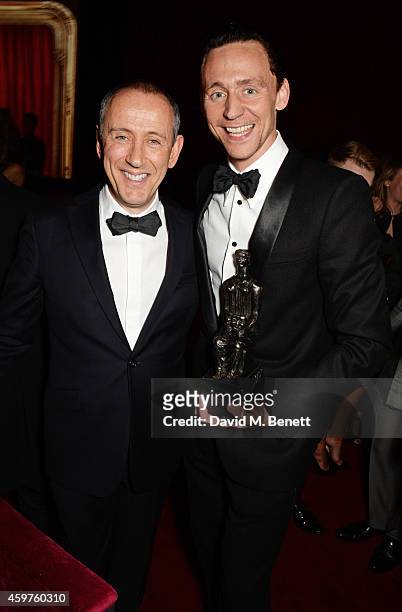 Nicholas Hytner and Tom Hiddleston, winner of the Best Actor award for 'Coriolanus', attend an after party following the 60th London Evening Standard...