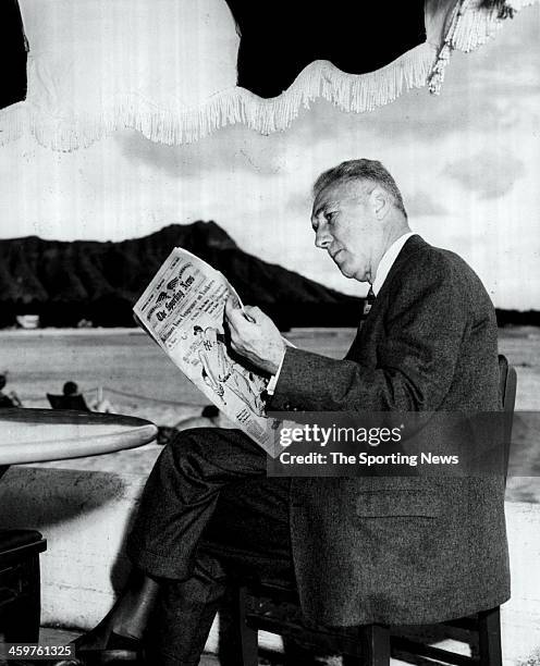 Major League Baseball Commissioner Ford Frick reads the Sportsing News Newspaper circa 1953.