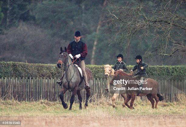 Charles, Prince of Wales, Prince William, and Prince Harry, riding at Sandringham Estate, Norfolk, on December 27, 1990 in Sandringham, United...