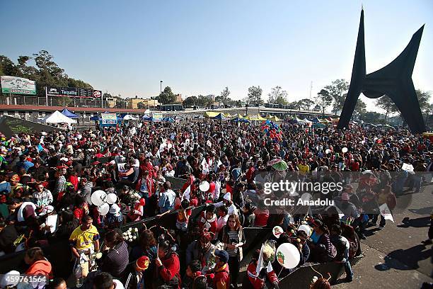 People take part in homage to Mexican comedian, screenwriter, TV producer, actor and director Roberto Gomez Bolanos at Azteca Stadium on November 30,...