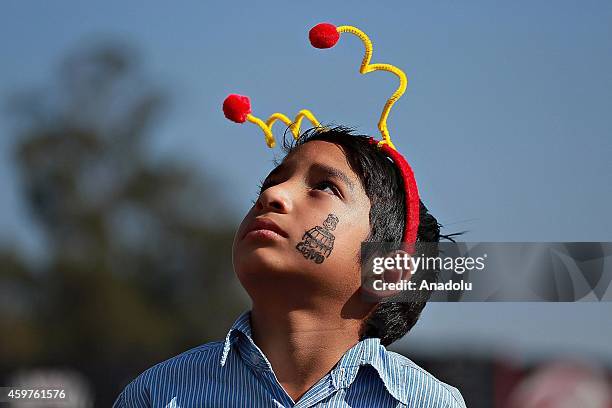 Boy dressed as El Chapulin Colorado character of the sitcom "El Chapulin Colorado" takes part in homage to Mexican comedian, screenwriter, TV...