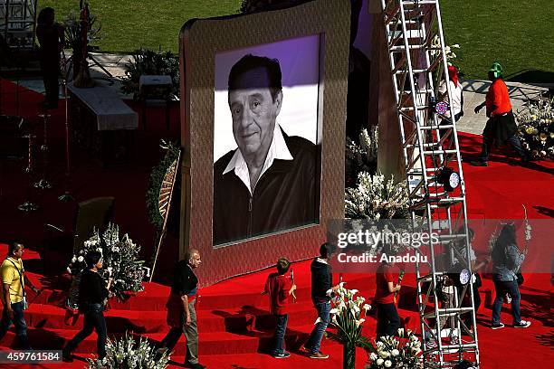 People take part in homage to Mexican comedian, screenwriter, TV producer, actor and director Roberto Gomez Bolanos at Azteca Stadium on November 30,...