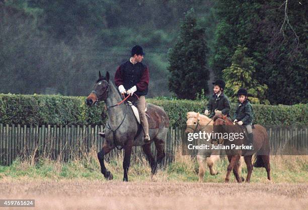 Charles, Prince of Wales, Prince William, and Prince Harry, riding at Sandringham Estate, Norfolk, on December 27, 1990 in Sandringham, United...