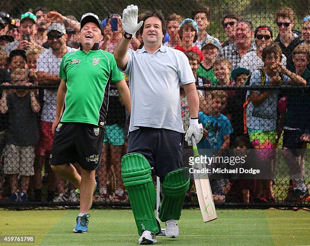 Triple M radio host Mick Molloy reacts in front of Mornington Peninsula cricketing legend Jason Mathers after facing bowling by Australian cricket...
