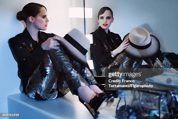 Singer Anna Calvi is photographed for Madame Figaro on September 26, 2013 in Paris, France. Shirt , pants , necklace personal, hat , shoes , clutch ....