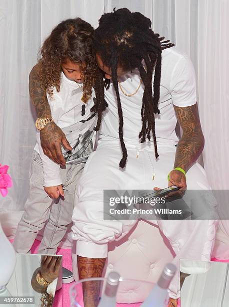Dwayne Carter III and Lil Wayne attend Reginea's "All White" Sweet 16 birthday party at Summerour Studio on November 29, 2014 in Atlanta, Georgia.