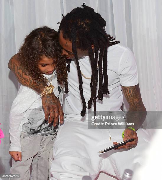 Dwayne Carter III and Lil Wayne attend Reginea's "All White" Sweet 16 birthday party at Summerour Studio on November 29, 2014 in Atlanta, Georgia.