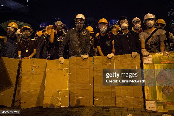 Pro-democracy protesters prepare to clash with police outside Hong Kong's Government complex on December 1, 2014 in Hong Kong. Leaders from the...
