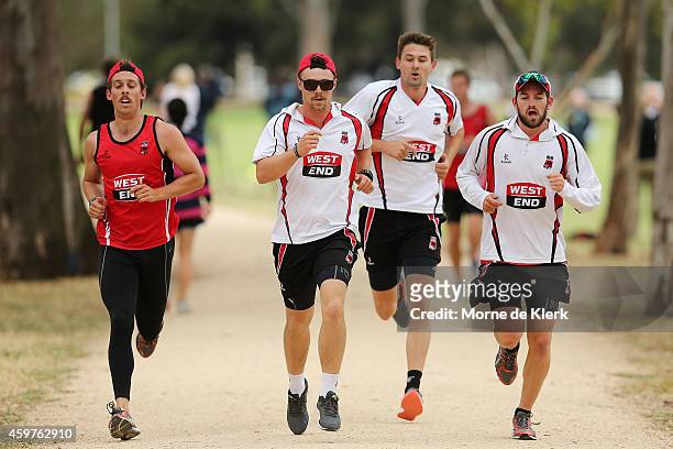 Jake Lehmann, Travis Head, Kane Richardson and Chadd Sayers runs around the uni-loop during a South Australian Redbacks training session at The Uni...