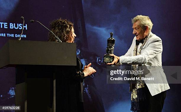 Kate Bush accepts the Editor's Award for 'Before The Dawn' from Sir Ian McKellen at the 60th London Evening Standard Theatre Awards at the London...