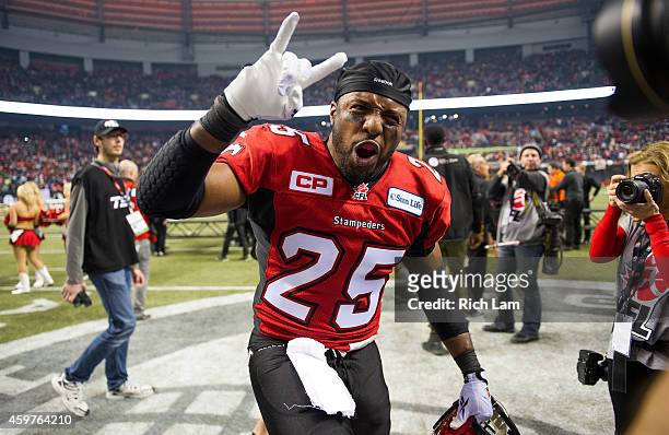 Keon Raymond of the Calgary Stampeders celebrates after defeating the Hamilton Tiger-Cats to win the 102nd Grey Cup Championship Game at BC Place...