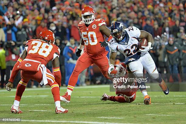 Anderson of the Denver Broncos runs the ball for a touchdown against Kurt Coleman, Ron Parker, and Justin Houston of the Kansas City Chiefs during...