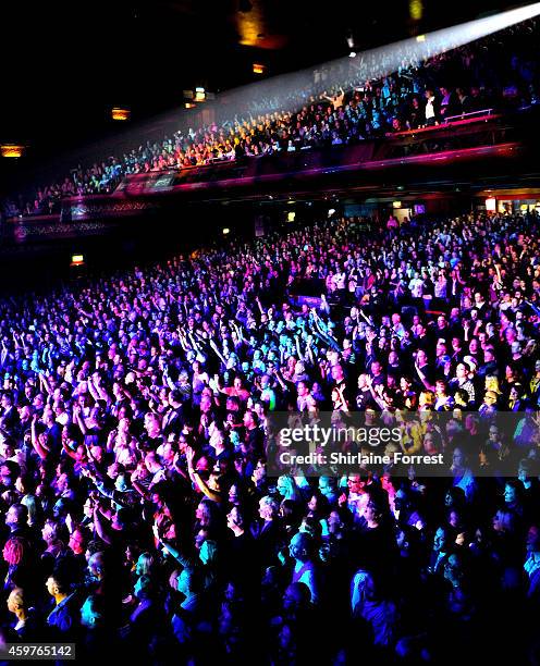 Fans of Erasure watch the band performing at 02 Apollo Manchester on November 30, 2014 in Manchester, England.