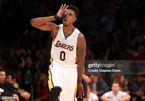 Nick Young of the Los Angeles Lakers celebrates after making a three point shot late in the fourth quarter against the Toronto Raptors at Staples...