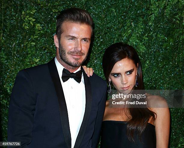 David Beckham and Victoria Beckham attends the 60th London Evening Standard Theatre Awards at London Palladium on November 30, 2014 in London,...