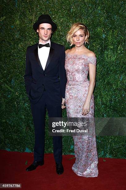 Sienna Miller and Tom Sturridge attends the 60th London Evening Standard Theatre Awards at London Palladium on November 30, 2014 in London, England.