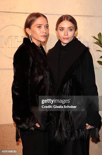 Mary-Kate Olsen and her twin sister Ashley Olsen pose during Mary-Kate Olsen and Ashley Olsen present their collection 'The Row' at Marion Heinrich...