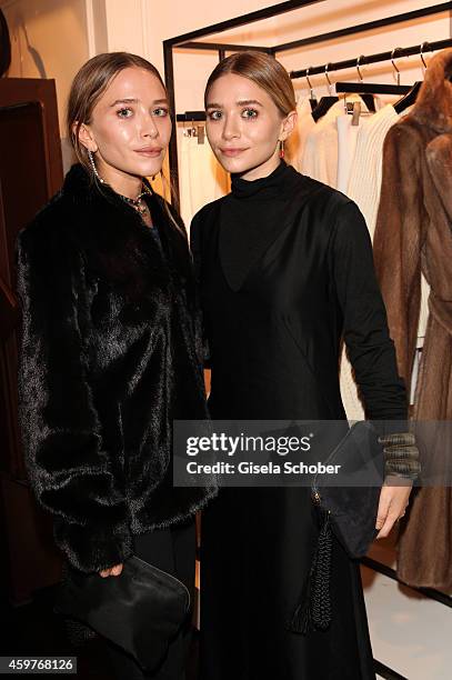 Mary-Kate Olsen and her twin sister Ashley Olsen pose during Mary-Kate Olsen and Ashley Olsen present their collection 'The Row' at Marion Heinrich...