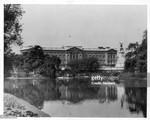 View of Buckingham Palace from the lake in St James Park in London, England. Circa 1950.