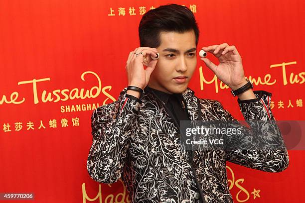 Singer Kris of EXO helps Madame Tussauds Wax Museum to built his own wax figure on December 1, 2014 in Shanghai, China.