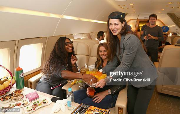 Ana Ivanovic of the Indian Aces takes on the roll of stewardess as she serves drinks to Serena Williams and Daniela Hantuchova of the Singapore...