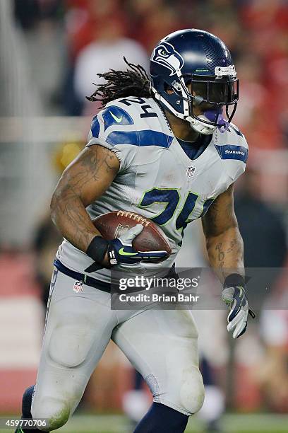 Running back Marshawn Lynch of the Seattle Seahawks runs against the San Francisco 49ers in the second quarter on November 27, 2014 at Levi's Stadium...