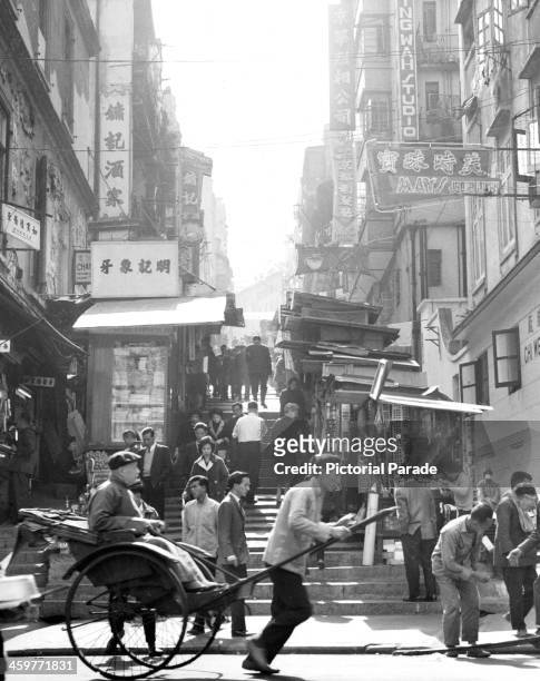 Street scene in Hong Kong. Circa 1950.