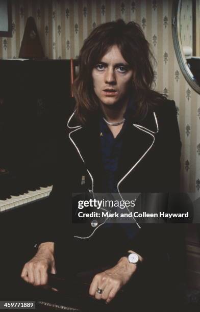 Drummer Roger Taylor from English rock group Queen posed in Freddie Mercury's flat, Holland Road, West Kensington, London in early 1974.