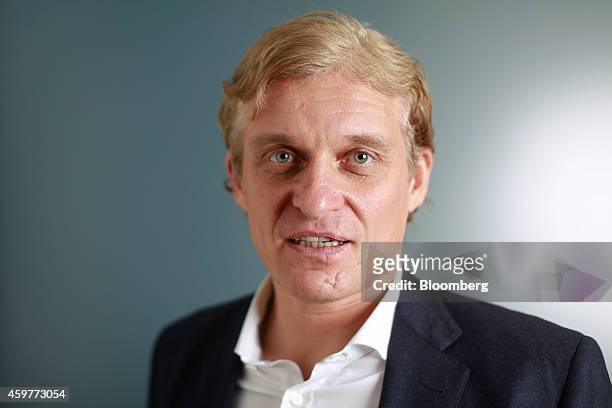 Oleg Tinkov, a Russian millionaire and founder of TCS Group Holding Plc, poses for a photograph after a Bloomberg Television interview in London,...