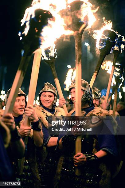 Men dressed as Vikings take part in the torchlight procession as it makes its way through Edinburgh for the start of the Hogmanay celebrations on...