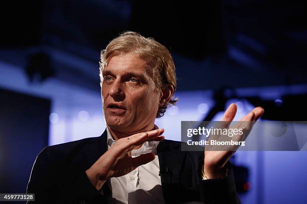 Oleg Tinkov, a Russian millionaire and founder of TCS Group Holding Plc, gestures as he speaks during a Bloomberg Television interview in London,...