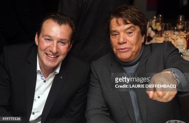 Belgium's head coach Marc Wilmots and French businessman Bernard Tapie attend the third edition of the Raymond Goethals award, presented annually to...