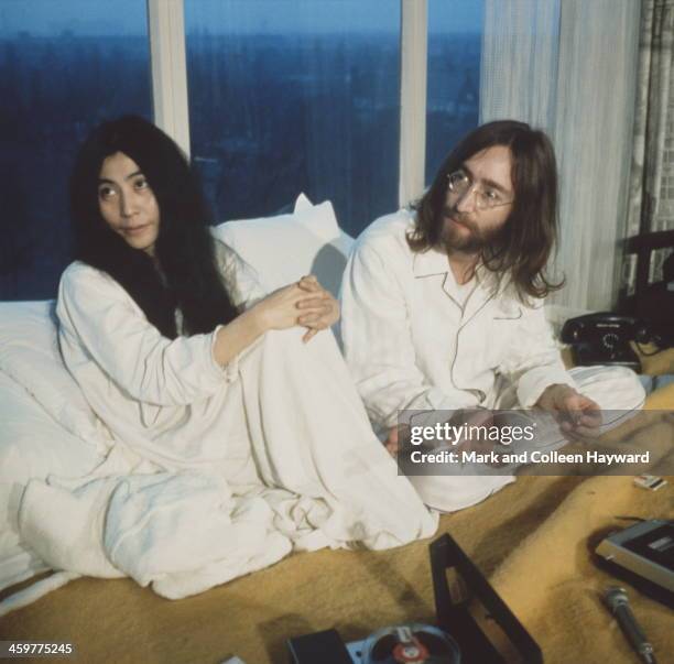 1st MARCH: Married musicians Yoko Ono and John Lennon during their 'Bed-In' in the Presidential suite of the Hilton hotel in Amsterdam, Netherlands...