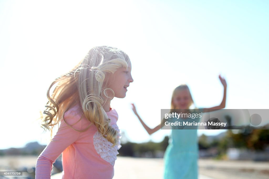 Sisters Playing Together outdoors