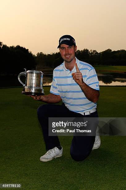 Niall Kearney of Royal Dublin Golf Club poses for a photograph with the trophy during day three of the Titleist PGA Play-Offs at Antalya Golf Club on...