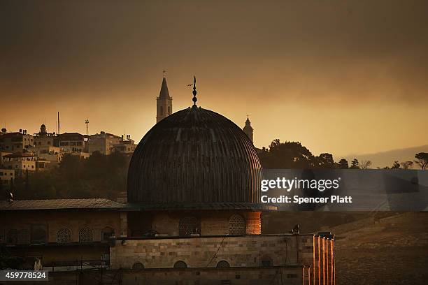 The sun rises over the Old City in Jerusalem on December 01, 2014 in Jerusalem, Israel. The Dome of the Rock is the fought over holy site between...