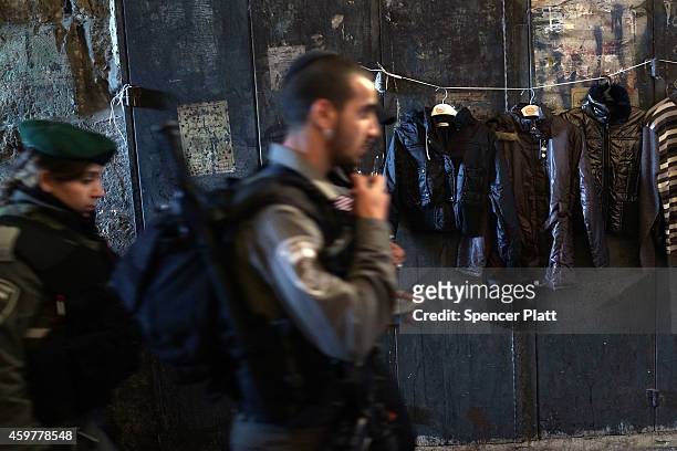 Israeli police patrol through the market in the Old City in Jerusalem on December 01, 2014 in Jerusalem, Israel. As violence continues in Israel, an...