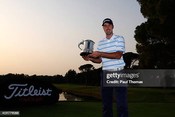 Niall Kearney of Royal Dublin Golf Club poses for a photograph with the trophy during day three of the Titleist PGA Play-Offs at Antalya Golf Club on...