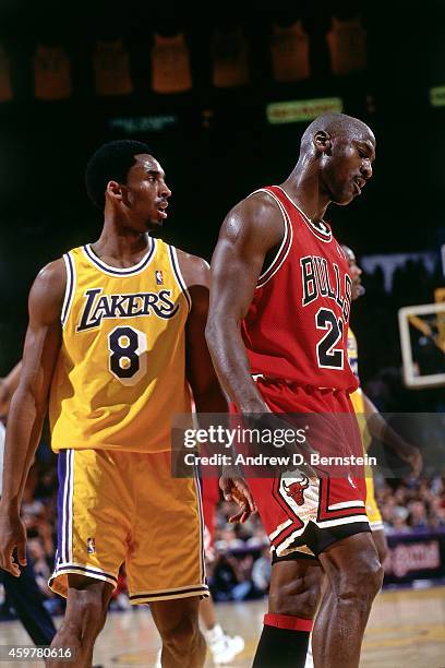 Kobe Bryant of the Los Angeles Lakers defends against Michael Jordan of the Chicago Bulls on February 1, 1998 at The Forum in Inglewood, California....