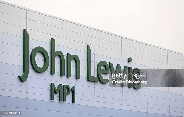John Lewis logo sits outside the John Lewis Plc semi-automated distribution centre in Milton Keynes, U.K., on Monday, Dec. 1, 2014. The pound rallied...