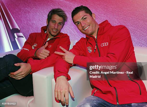 Cristiano Ronaldo and Fabio Coentrao of Real Madrid pose during the car handover of Audi at Ciudad Real Madrid on December 1, 2014 in Madrid, Spain.