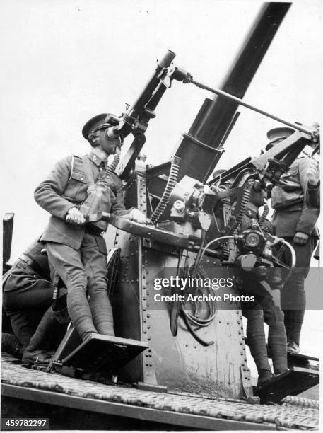 Member of the Royal Army Medical Corps trains on using the Anti-aircraft gun in Aldorshot, England.Circa 1930.