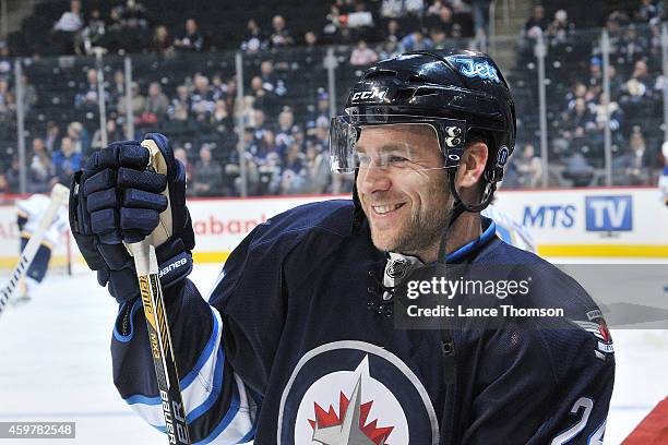 Grant Clitsome of the Winnipeg Jets looks on during the pre-game warm up prior to NHL action against the St. Louis Blues on November 23, 2014 at the...