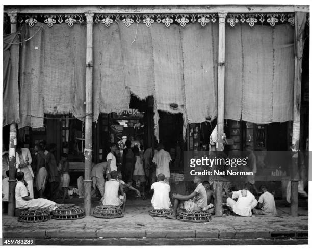 Street view of a market place in Calcutta, India. Circa 1950.