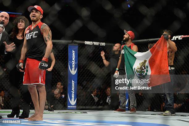 Henry Briones celebrates after defeating Guido Cannetti in their bantamweight bout during the UFC 180 event at Arena Ciudad de Mexico on November 15,...
