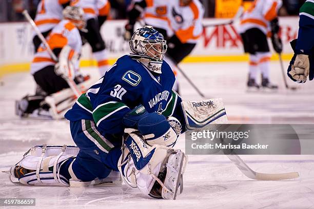 Joacim Eriksson of the Vancouver Canucks warms up against the Philadelphia Flyers on December 30, 2013 at Rogers Arena in Vancouver, British...