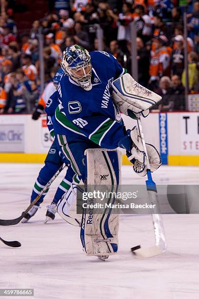 Joacim Eriksson of the Vancouver Canucks warms up against the Philadelphia Flyers on December 30, 2013 at Rogers Arena in Vancouver, British...