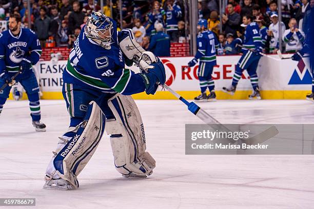 Joacim Eriksson of the Vancouver Canucks warms up against the Philadelphia Flyers on December 30, 2013 at Rogers Arena in Vancouver, British...